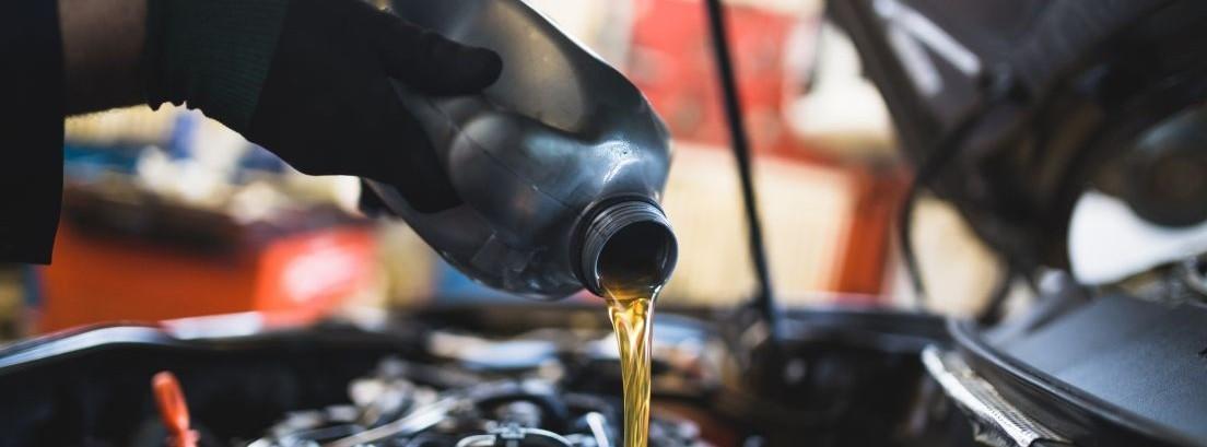 A mechanic wearing a black glove is pouring new oil into a car engine, which is an internal combustion engine, a type of heat engine that converts the chemical energy of a fuel into mechanical energy. It is used in vehicles, such as cars, trucks, motorcycles, and airplanes. The engine is made up of many parts, including the piston, crankshaft, camshaft, and valves. The piston moves up and down inside the cylinder, compressing the air and fuel mixture. The crankshaft converts the up-and-down motion of the piston into rotary motion. The camshaft opens and closes the valves, allowing air and fuel to enter the cylinder and exhaust gases to escape.